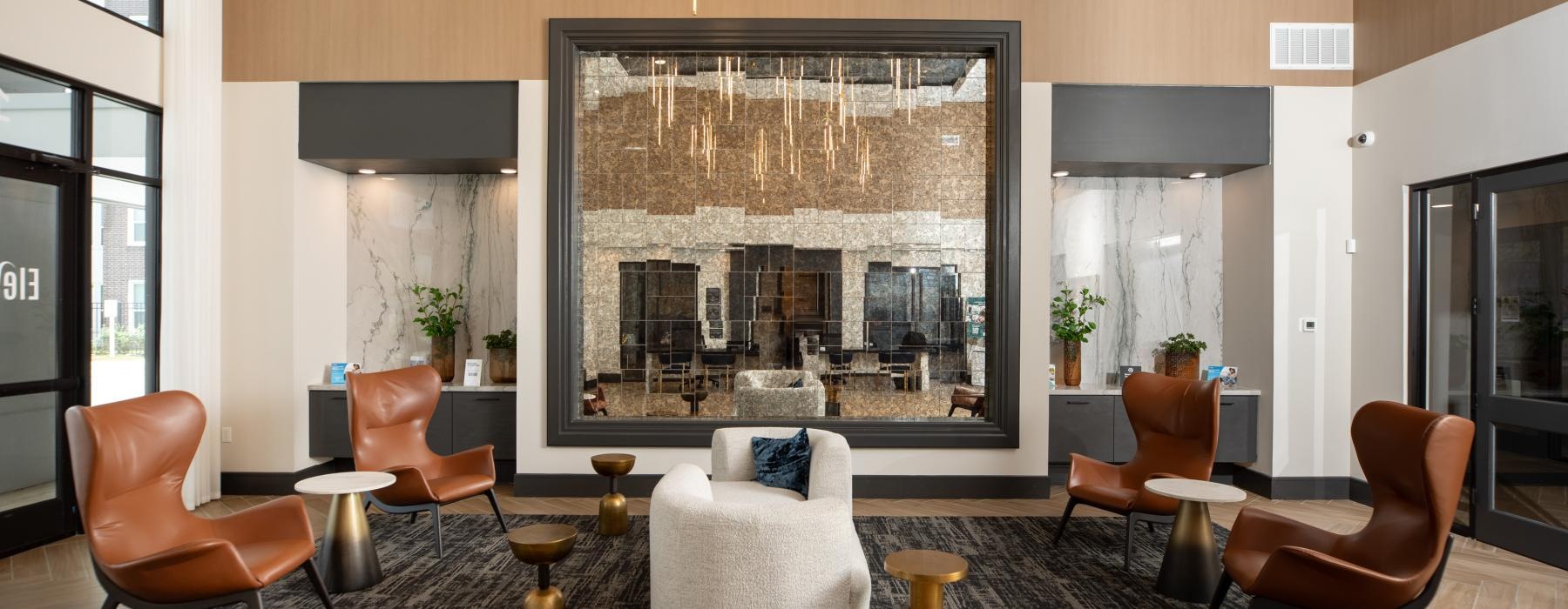 a room with chairs and a large window